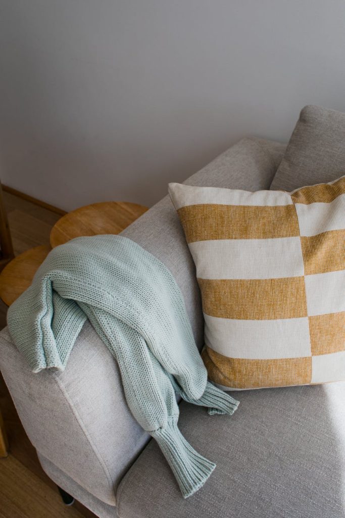 soft cozy sofa with striped pillow